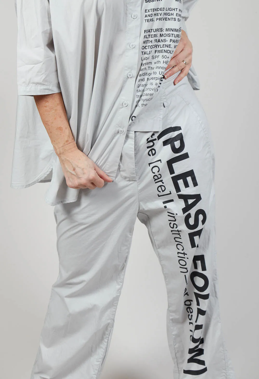 Wide Leg Trousers with Lettering Motif in Grey Print